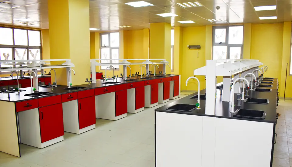 Laboratory with red cabinets and black epoxy resin counters